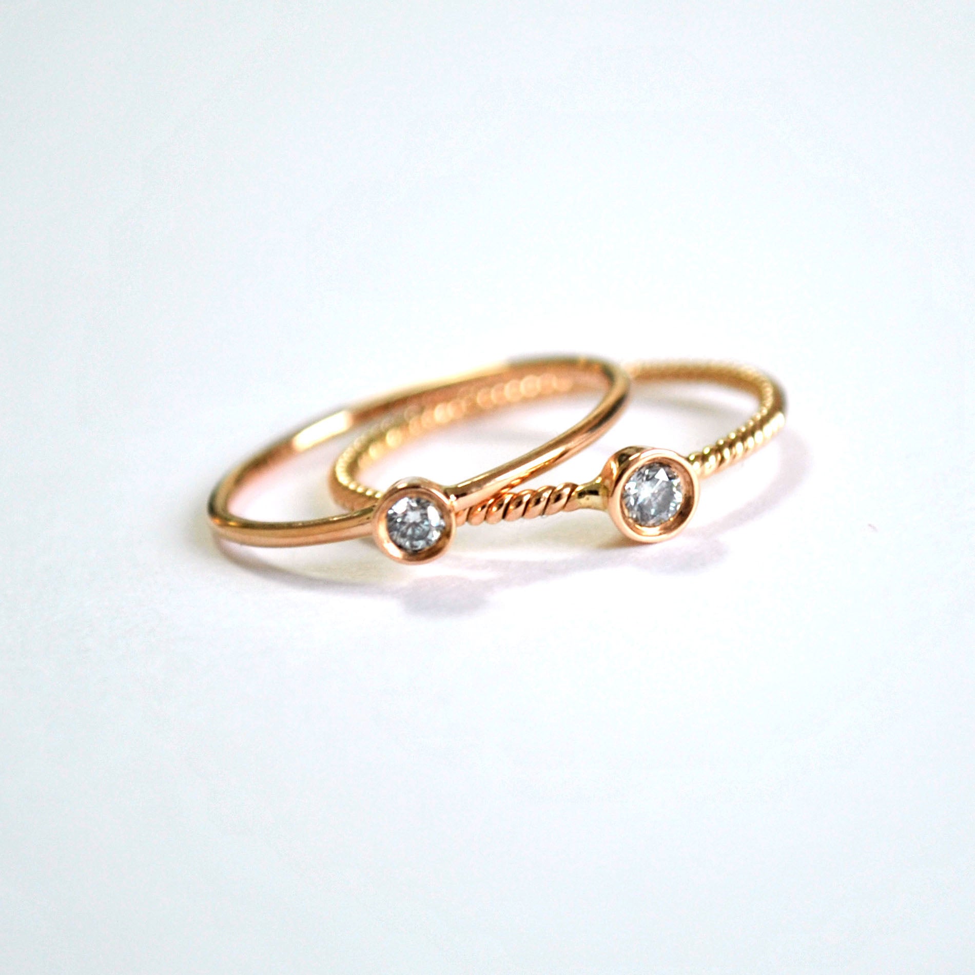 Bezel Set Small Round Diamond Ring with  Minimal twisted Wire Rope Band