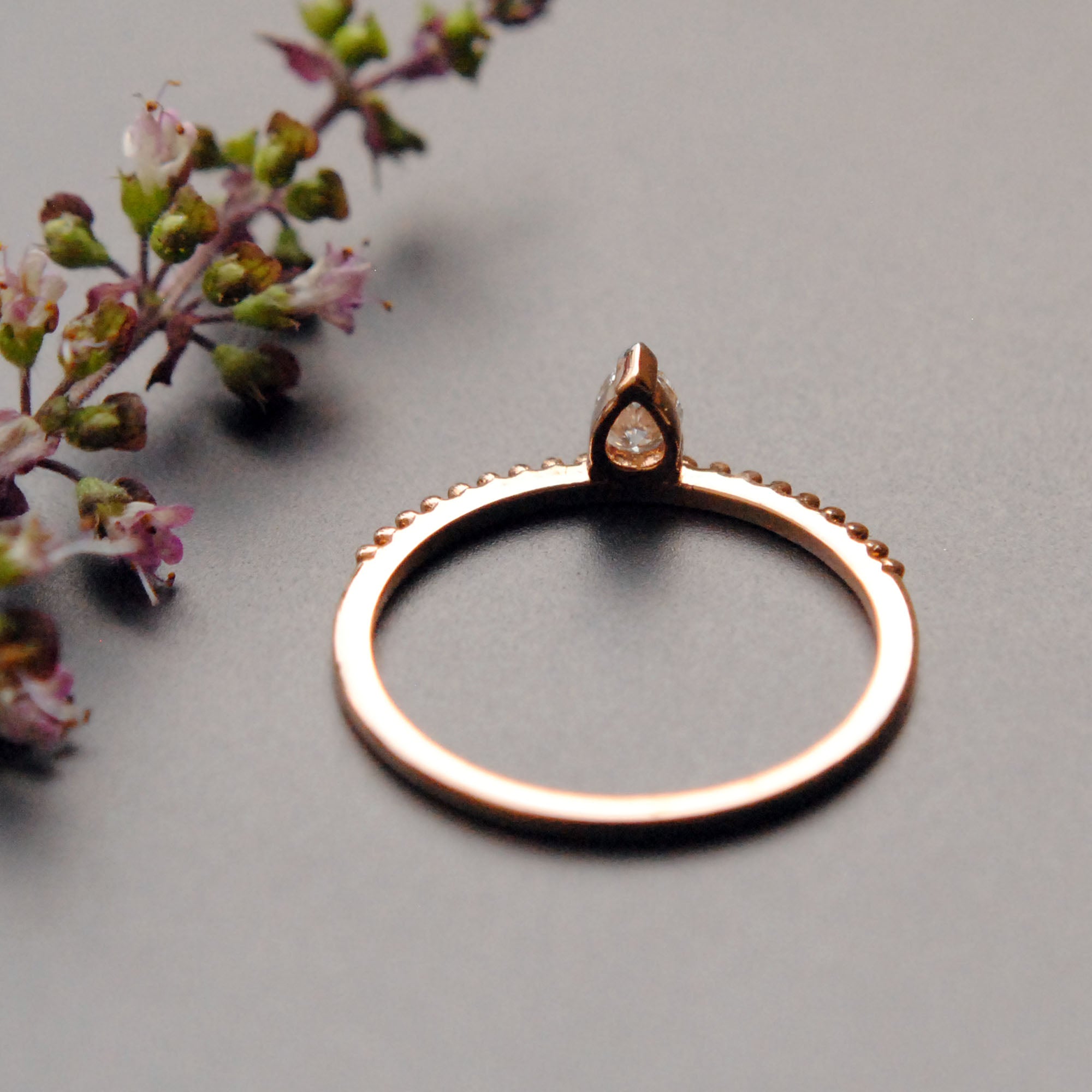 Off Centre Pear Diamond Ring with Milligrain Band