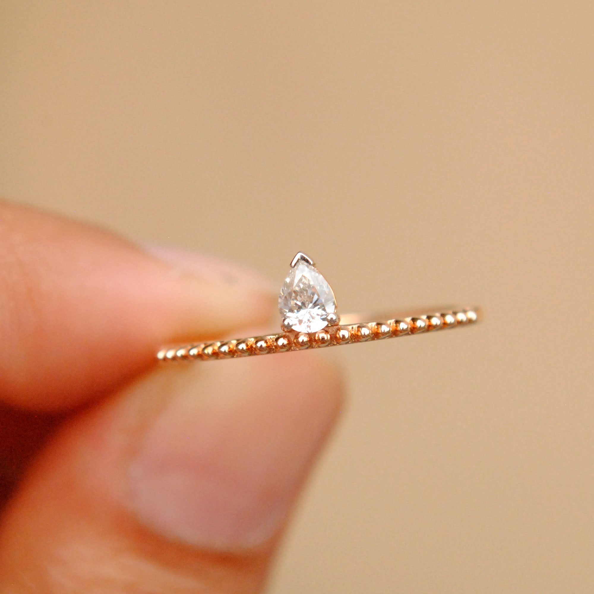 Off Centre Pear Diamond Ring with Milligrain Band
