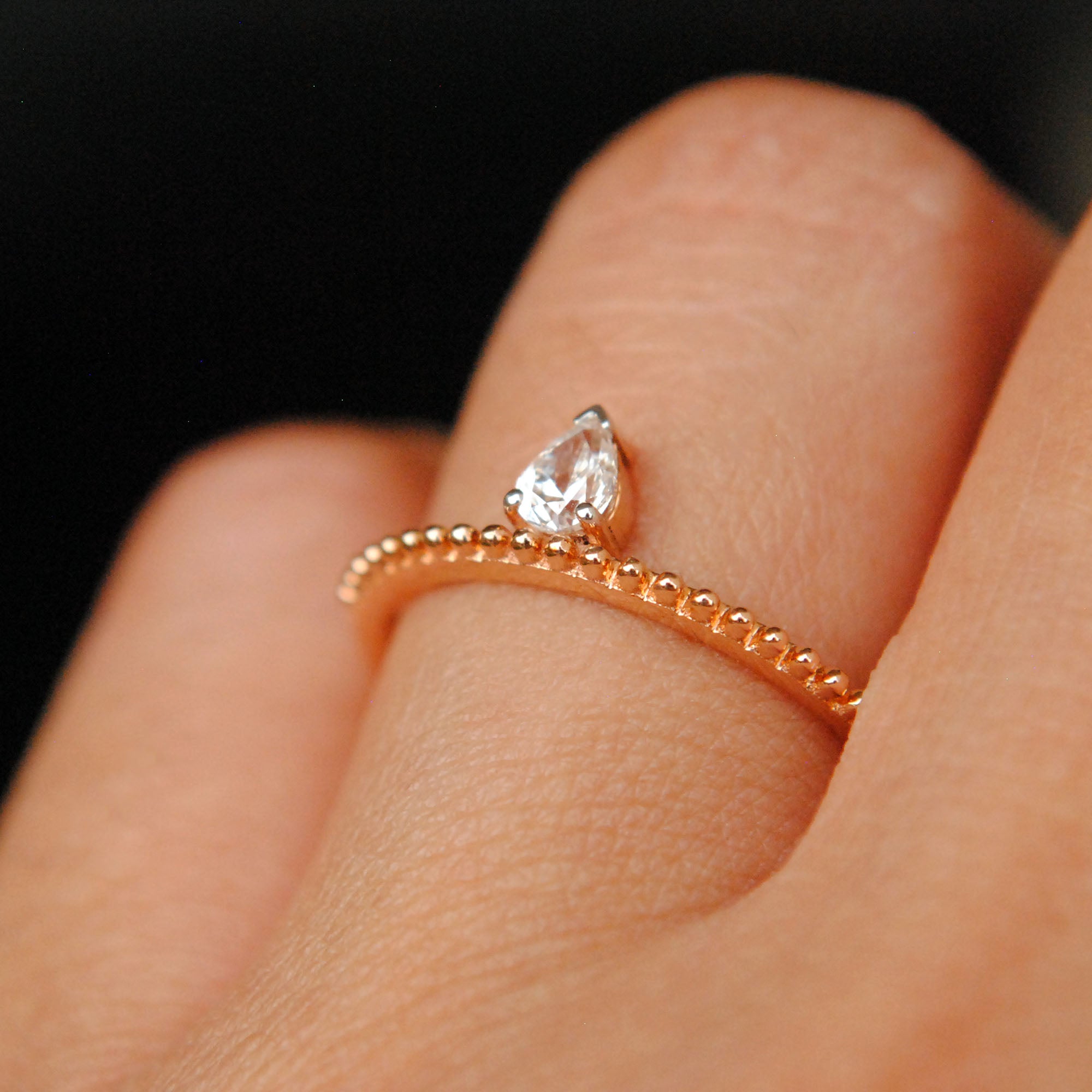 Off Centre Pear Diamond Ring with Milligrain Band