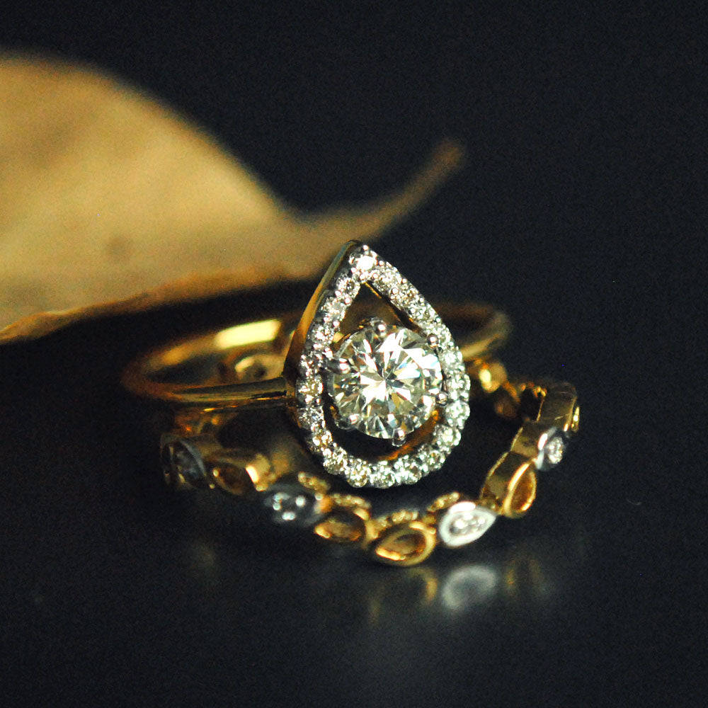 Half Carat Solitaire Diamond Engagement Ring with Unique Pear Halo