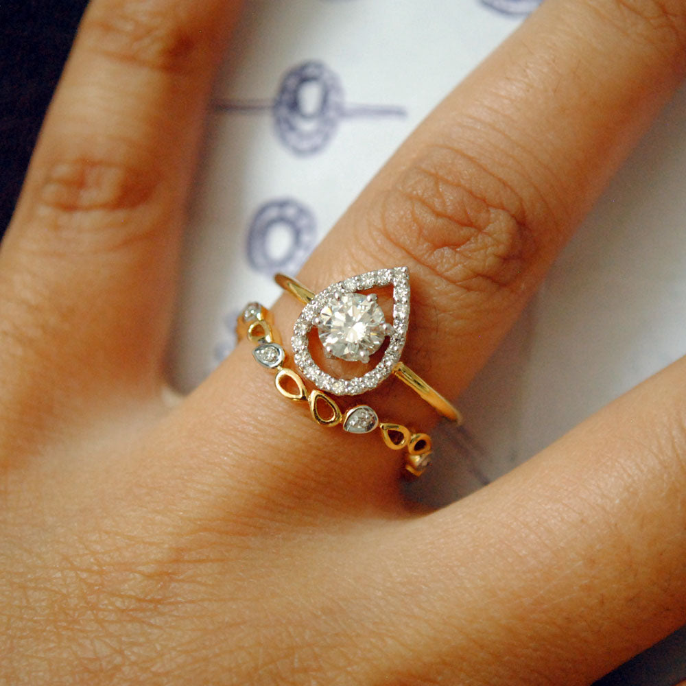 Half Carat Solitaire Diamond Engagement Ring with Unique Pear Halo