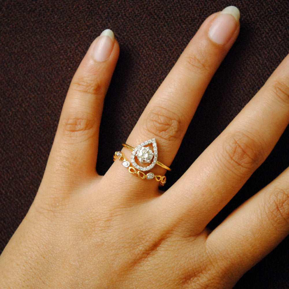 Half Carat Solitaire Diamond Engagement Ring with Unique Pear Halo