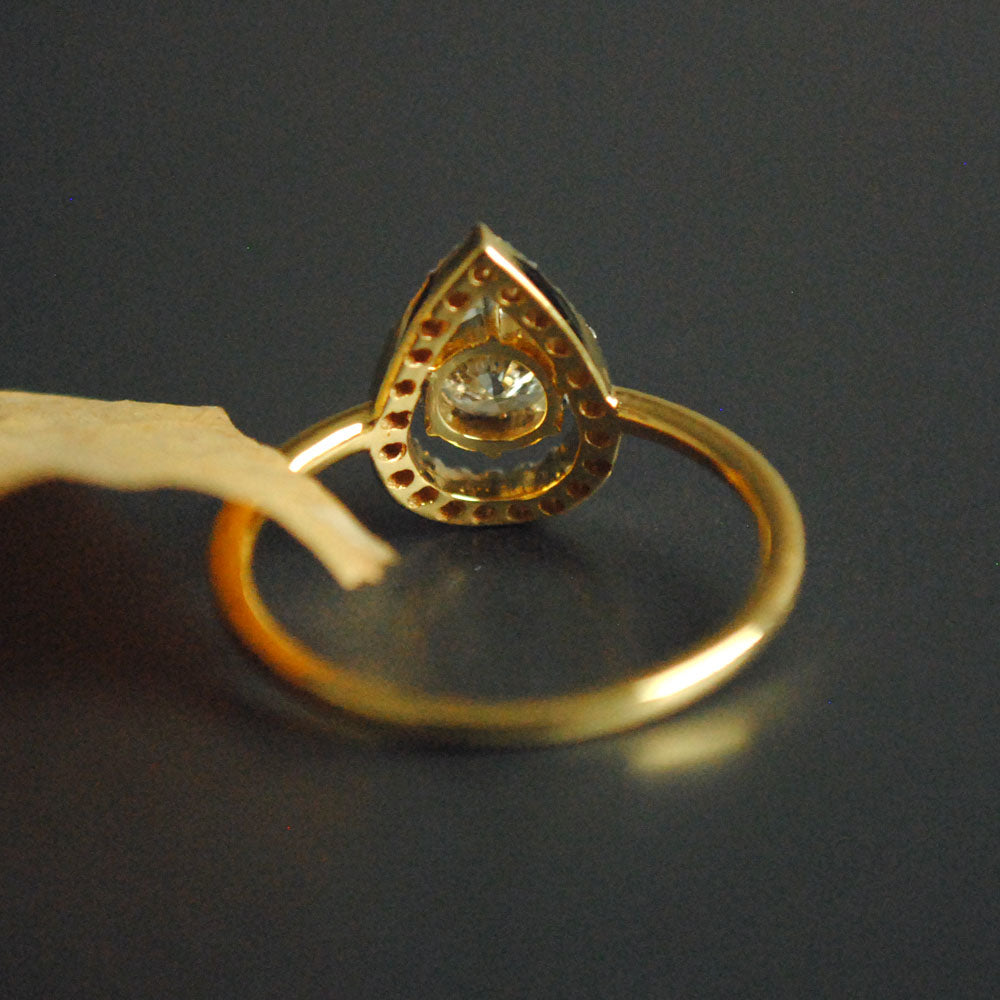 Half Carat Solitaire Diamond Engagement Ring with Unique Pear Halo