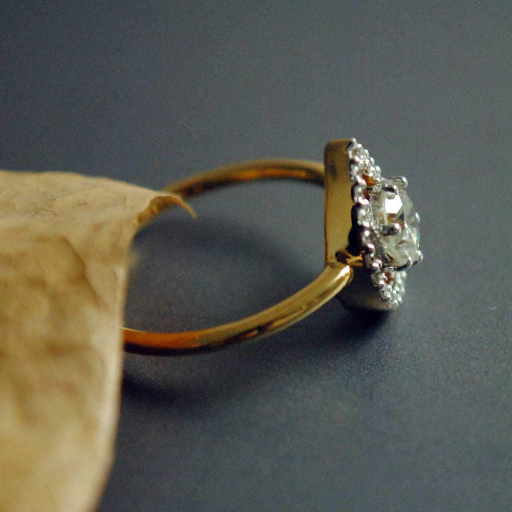 Half Carat Solitaire Diamond Engagement Ring with Unique Pear Halo