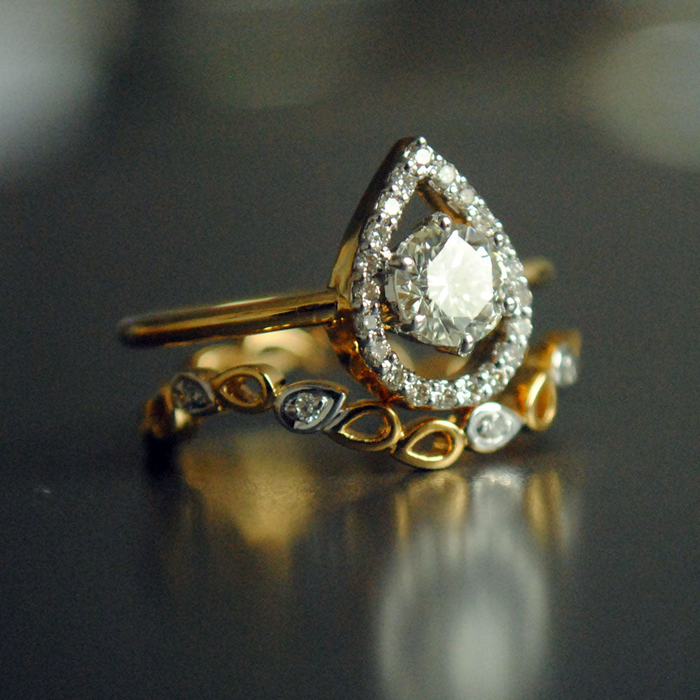 Half Carat Solitaire Diamond Engagement Ring with Unique Pear Halo