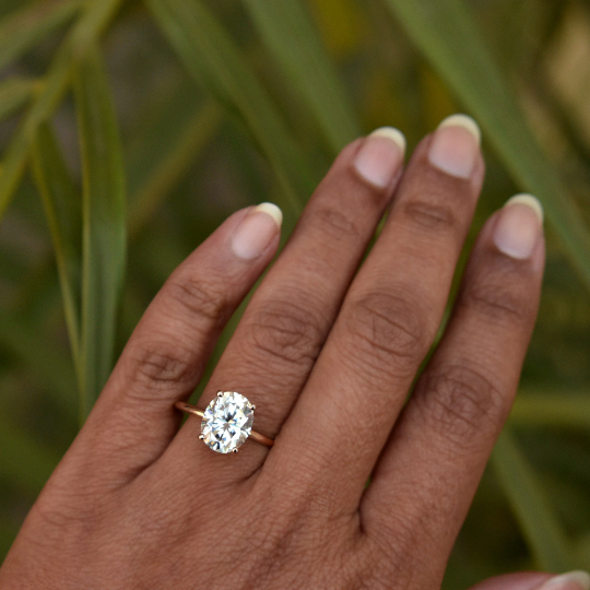 Oval Moissanite Engagement Ring with Fleur De Lis Head with Hidden Natural Diamond UnderHalo