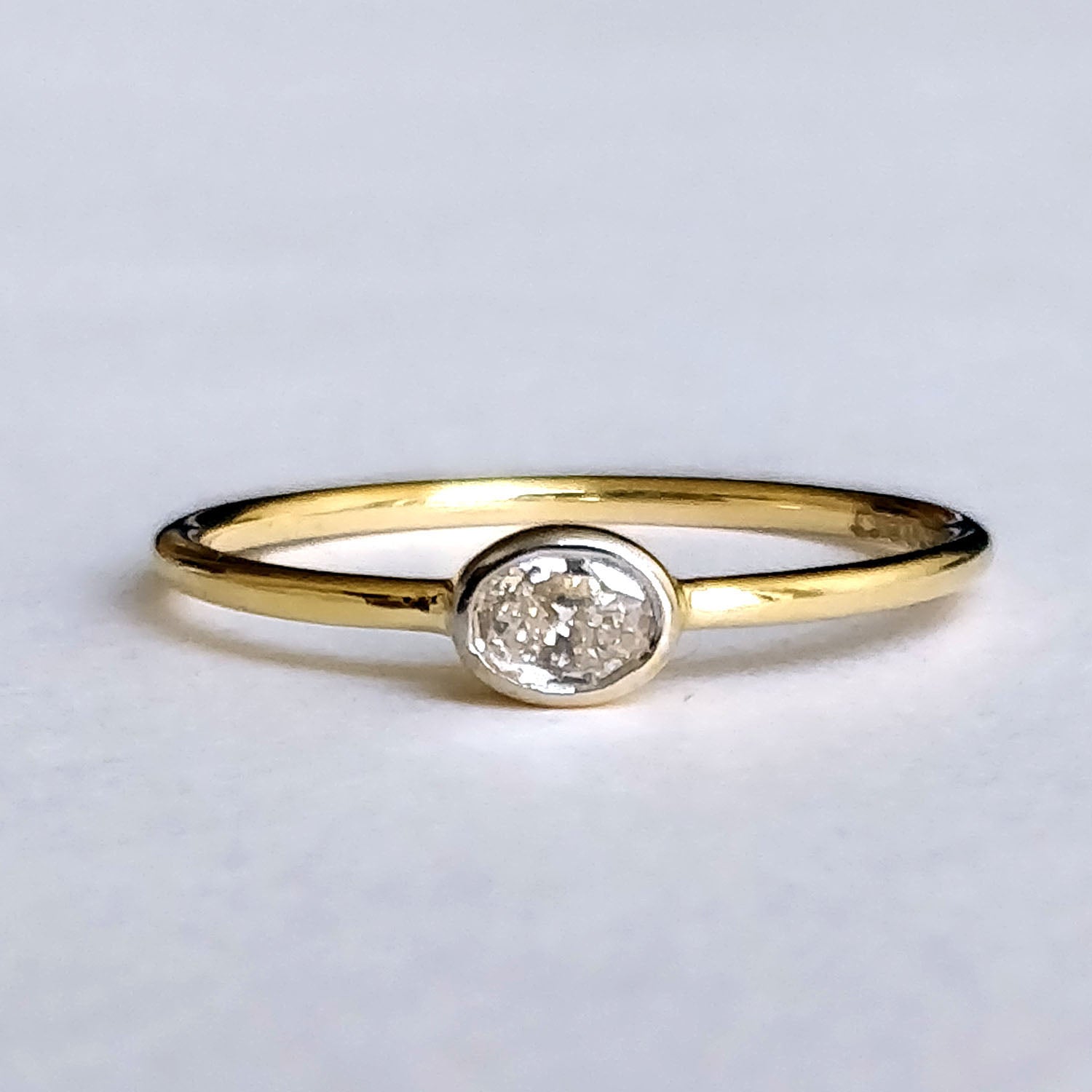 East West Minimal Bezel Set Oval Diamond Ring