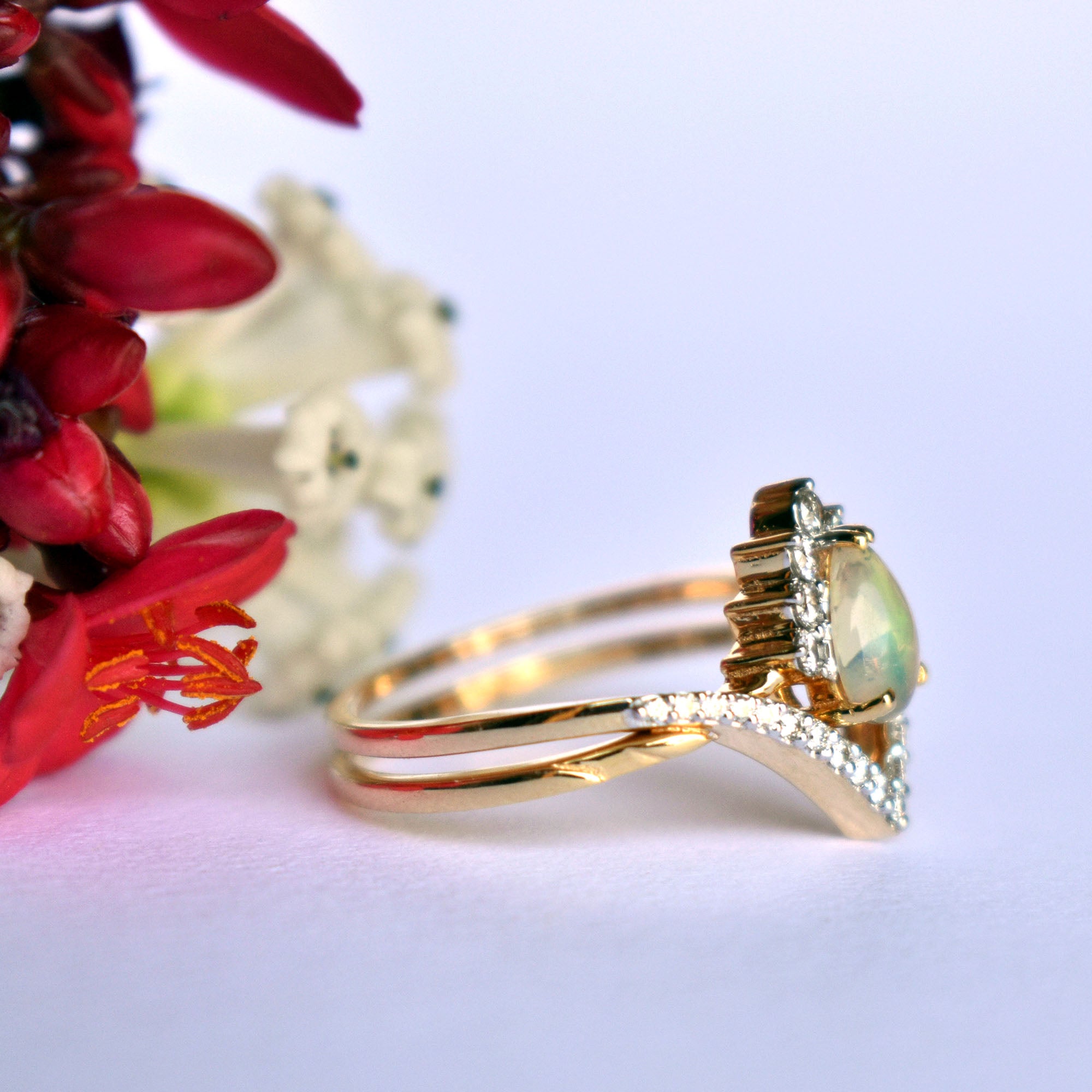 Premium Photo | Two wedding rings interlocked on white satin