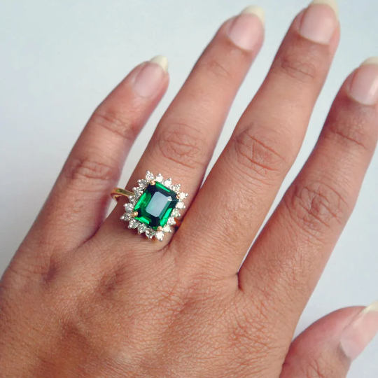 Emerald green stone ring with cz and platinum finish -