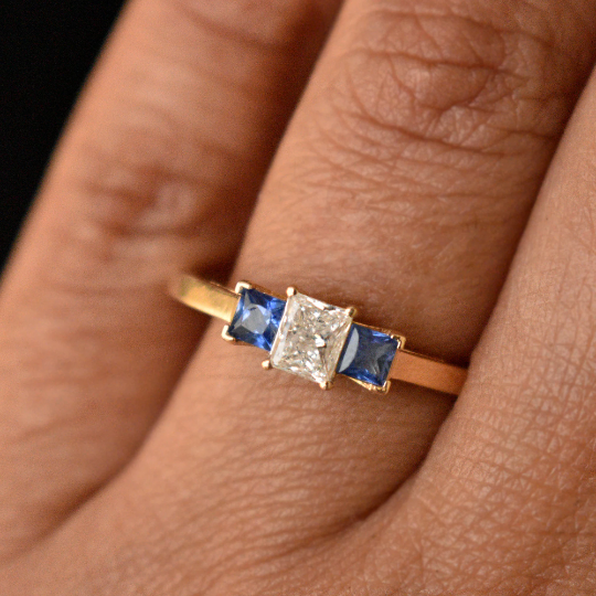 Sparkling Three-Stone Cushion Engagement Ring